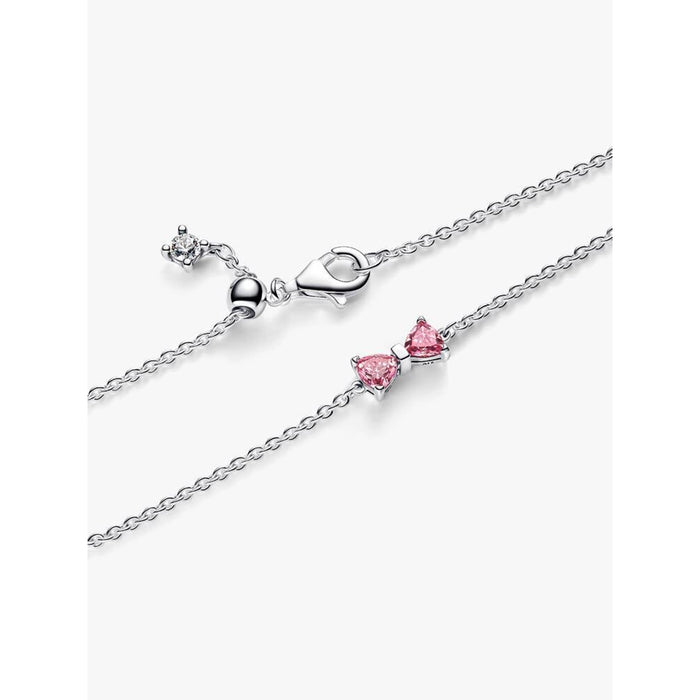 Close-up view of the Pandora Pink Bow Chain Bracelet showing the lobster clasp, extender, and pink stone bow charm.
