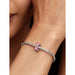 Model wearing a Pandora bracelet with the Pink Bow Charm displayed on the wrist.