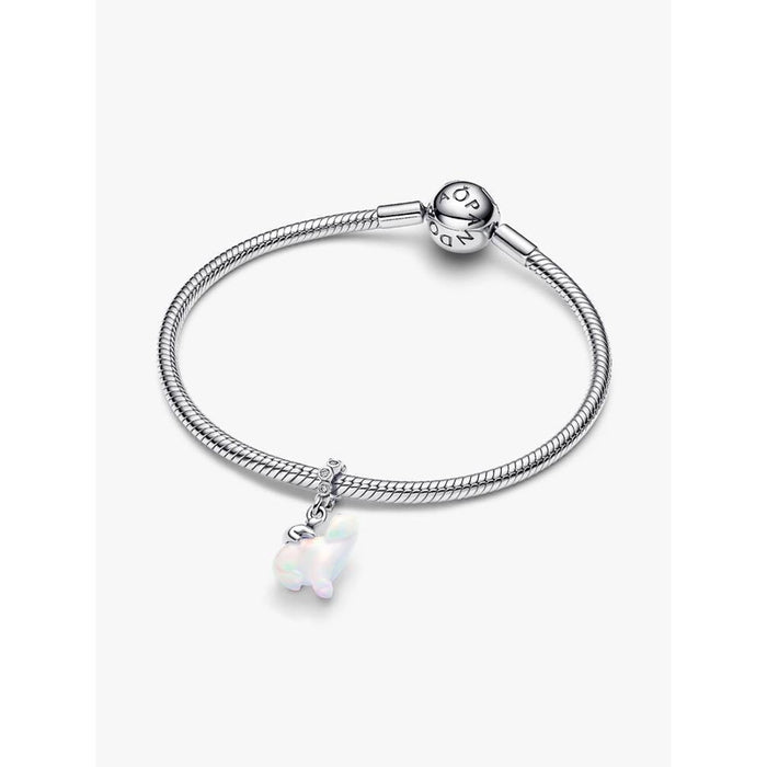 Pandora Moments bracelet with the Polar Bear Mother & Cub Dangle Charm displayed, showing the iridescent bear charm hanging from a silver snake-chain bracelet.