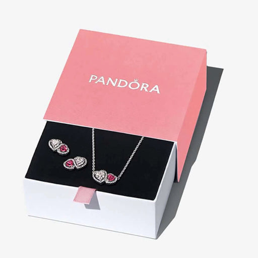 Pandora jewelry set with necklace and earrings in a pink box on a white background
