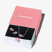 Pandora jewelry set with necklace and earrings in a pink box on a white background