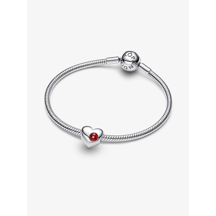 Silver bracelet with a heart-shaped charm on a white background