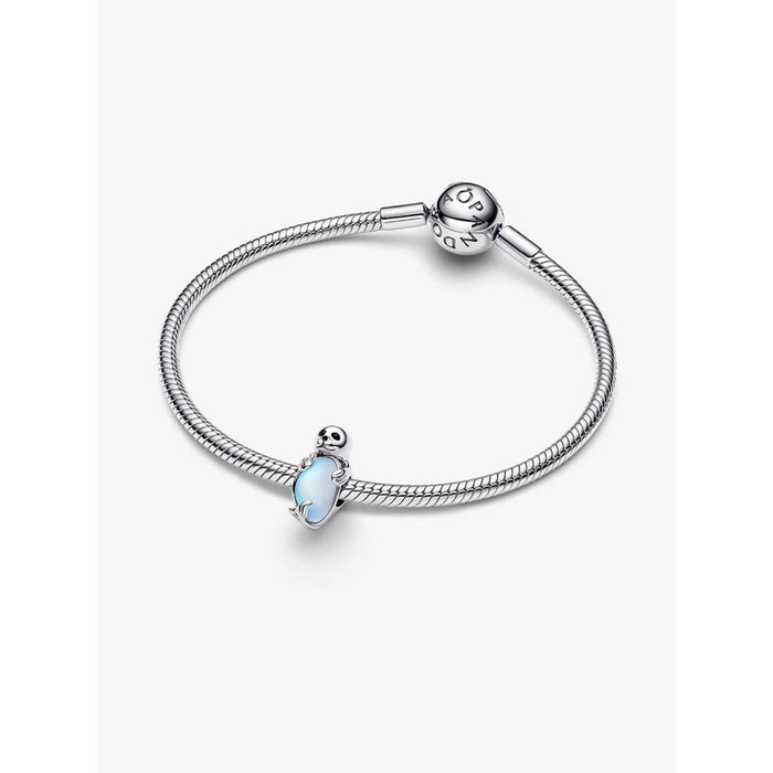 Pandora Moments silver bracelet displayed with the blue crystal Seal Charm attached.