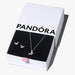 Pandora Sparkling Butterfly necklace and stud earrings set displayed on a white background.