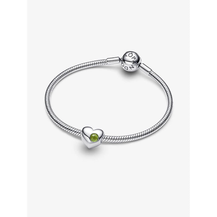 Pandora sterling silver bracelet featuring the Spring Green Stone Heart Charm with vibrant green crystal detail.
