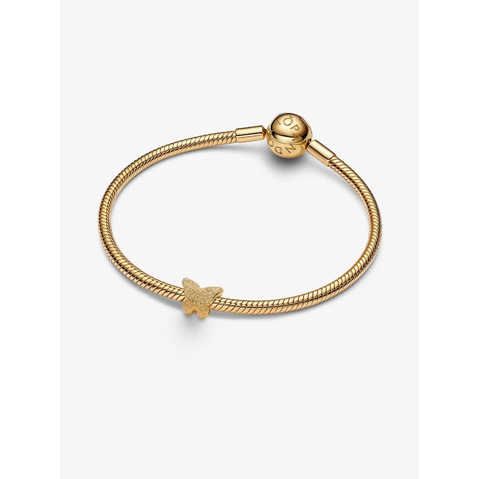 Gold snake chain bracelet with butterfly charm, featuring a minimalist clasp and a single textured butterfly bead at the center.