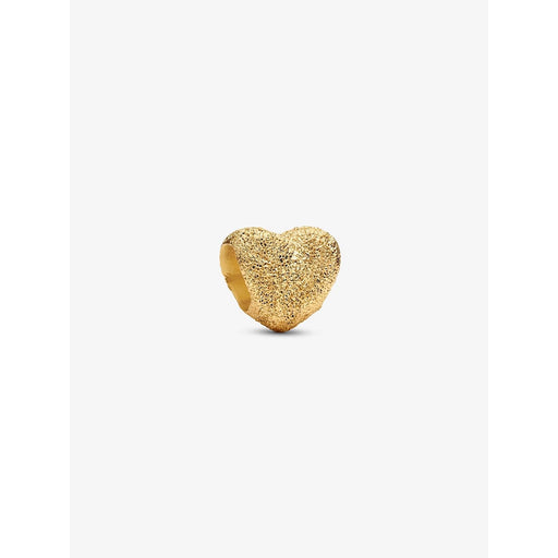 Close-up of a textured gold heart-shaped charm with a rugged, sparkling finish, displayed against a plain white background.