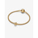 Pandora Shimmering Star Charm in gold worn on a gold snake chain bracelet with round clasp.