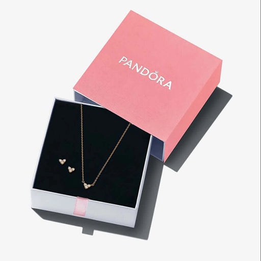 Pandora jewelry set with necklace and earrings in a pink box on a white background