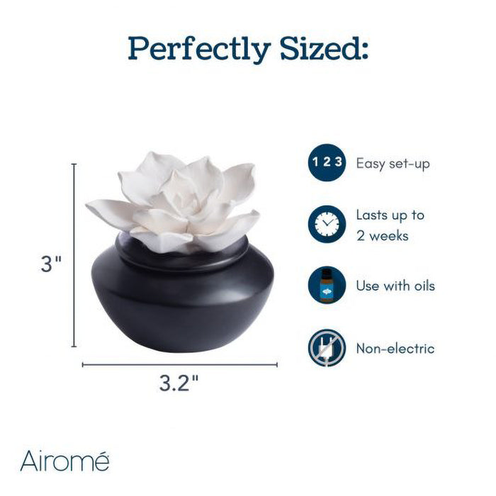 White ceramic flower diffuser with black base, dimensions, and features listed on a white background.