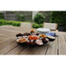 Outdoor setting with a wooden table and snack platter.
