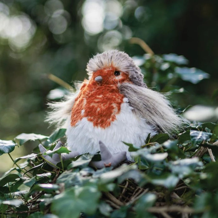 A plush bird with a striking red and white beak, designed to be soft and appealing for children.