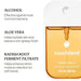 Touchland Spiced Pumpkin-Tini Power Mist hand sanitizer, 30 mL, in front of a whipped cream-topped drink.