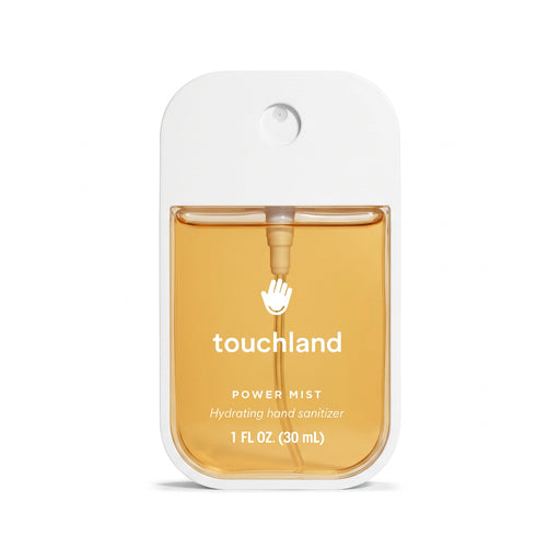 Touchland Spiced Pumpkin-Tini Power Mist hand sanitizer, 30 mL, in front of a whipped cream-topped drink.