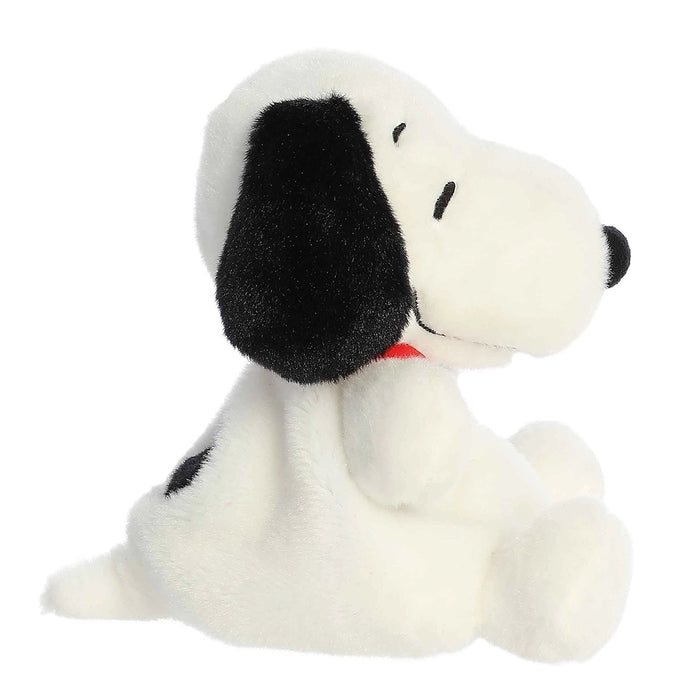 Side profile of Palm Pals Snoopy plush highlighting floppy ear and rounded plush body