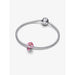 Silver Pandora bracelet with the Disney Cheshire Cat Charm attached, styled on a wrist. The charm shows the Cheshire Cat in bright pink enamel with a glitter finish.