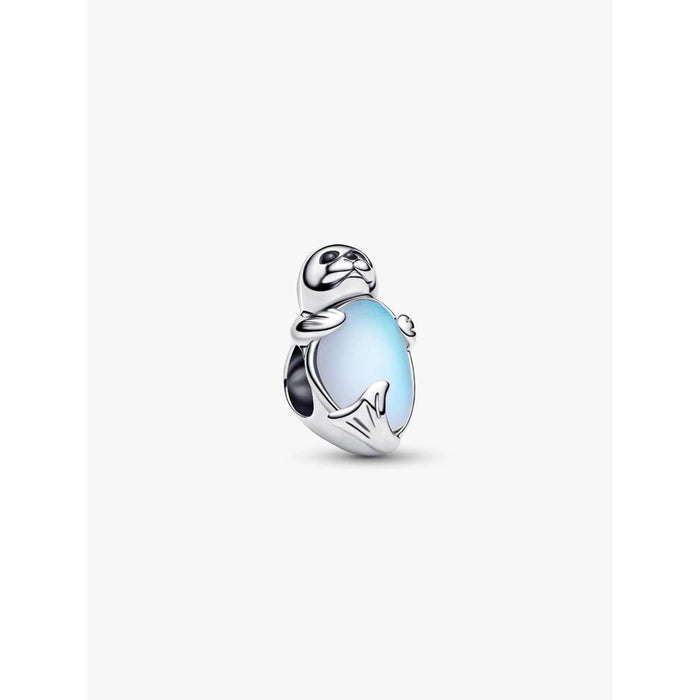 Close-up product image of the Pandora Seal Charm showing a sterling silver seal hugging a light blue man-made crystal.