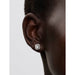 Model wearing Pandora Square Halo Stud Earrings showing square halo cubic zirconia design in sterling silver