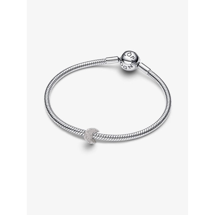 Pandora Textured Moon Mini Charm styled on a sterling silver snake chain bracelet with round Pandora clasp, shown on a white background.