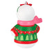 Decorative Christmas ornament with a white ball, red bow, pink scarf, and green sweater with tree pattern on a white background.