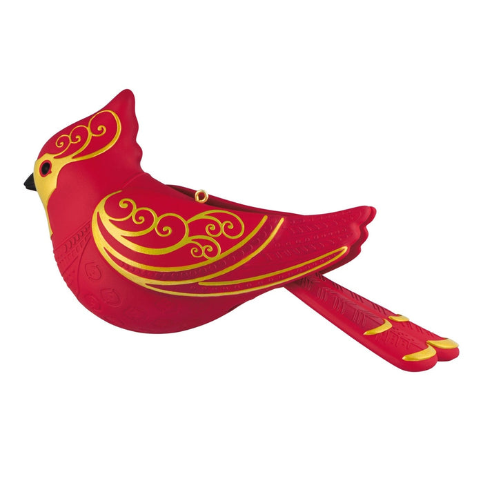 Front view of red cardinal ornament showcasing gold chest scrollwork and heart leaf patterns