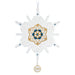 Decorative snowflake ornament with gold and blue design on a white background