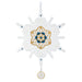 Decorative snowflake ornament with gold and blue center on a white background