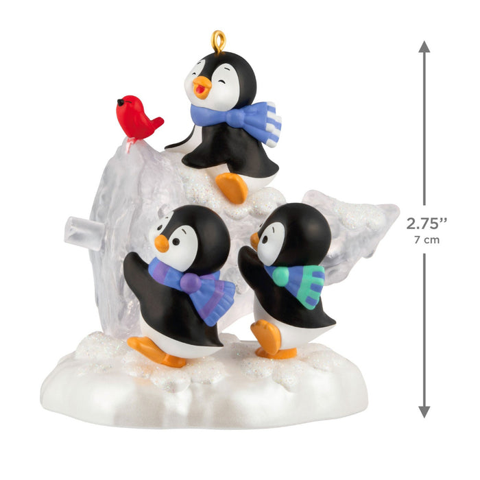 Decorative penguin figurine with a bird on a white background