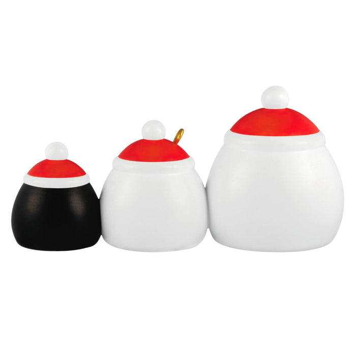Three decorative items with red and white tops on a white background