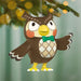 Decorative owl ornament with a green bow tie hanging on a tree branch.