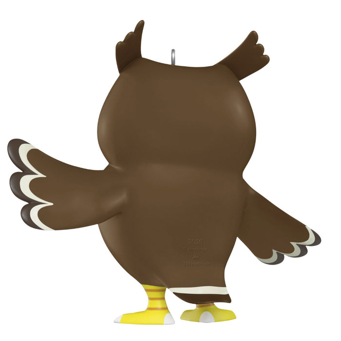 Brown owl figurine with yellow feet on a white background