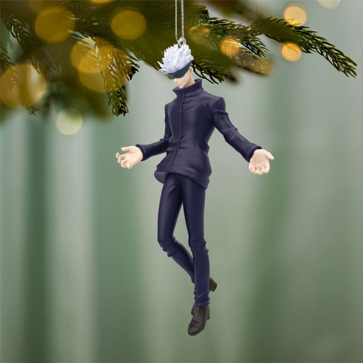 Character figurine ornament hanging from a tree with a blurred green background