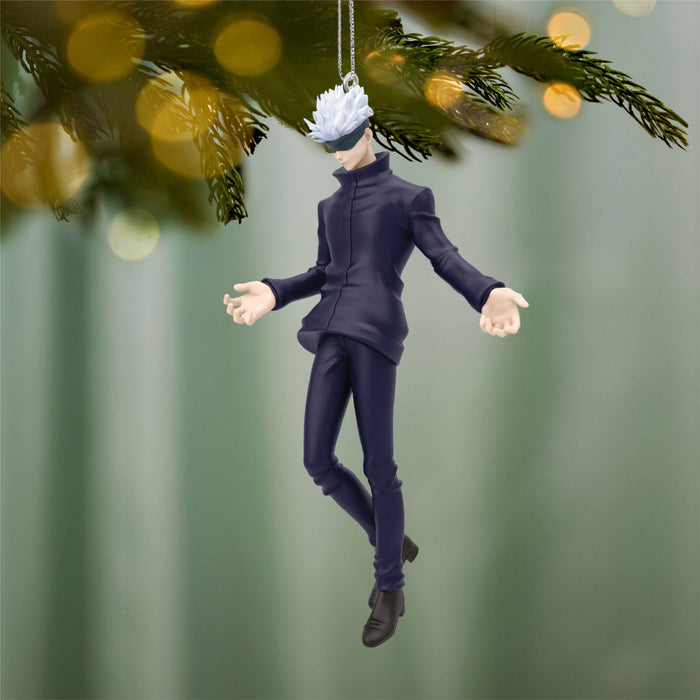 Character figurine ornament hanging from a tree with a blurred green background