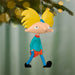 Glossy plastic Arnold Shortman ornament against pine branches