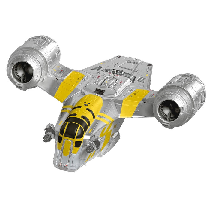 Three-quarter view of silver and yellow Star Wars Razor Crest ornament showing ribbed engine textures and panel lines