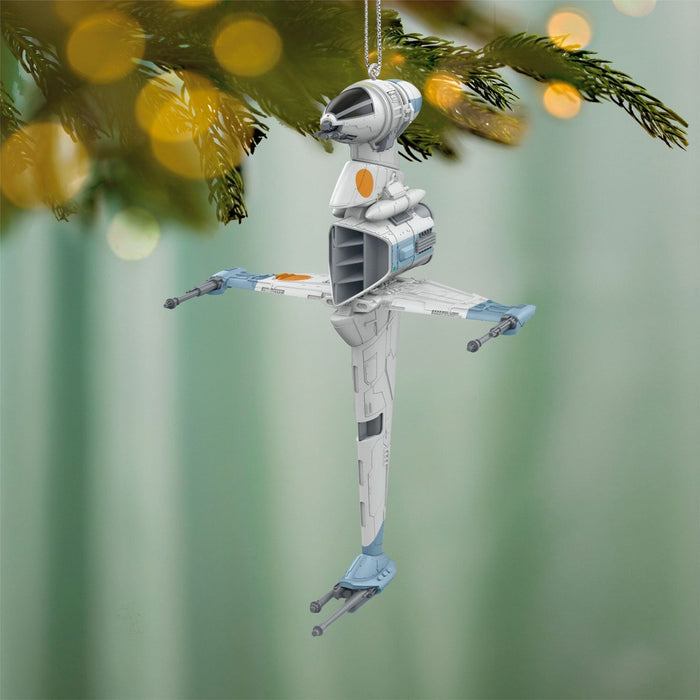 Star Wars B-Wing Fighter ornament front view hanging pine branch