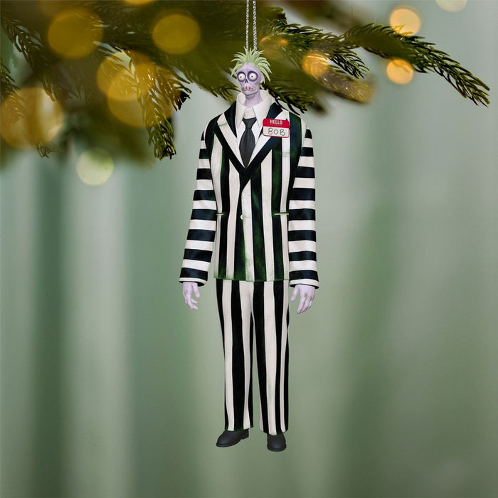 Beetlejuice Beetlejuice Bob ornament hanging on Christmas tree with lights