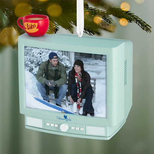 Gilmore Girls Christmas tree ornament hanging on pine branch with snowy bench lenticular display