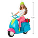 4.25 inch tall plastic Barbie Christmas ornament on scooter with red gift box detail