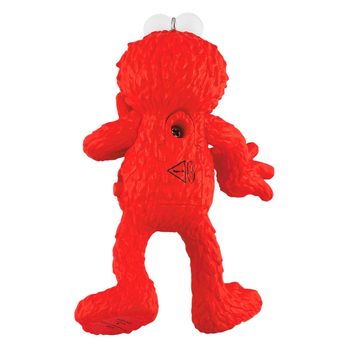Back of red plastic Elmo Christmas ornament showing battery compartment and suction hanger