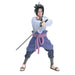 Anime character figurine holding a sword on a white background