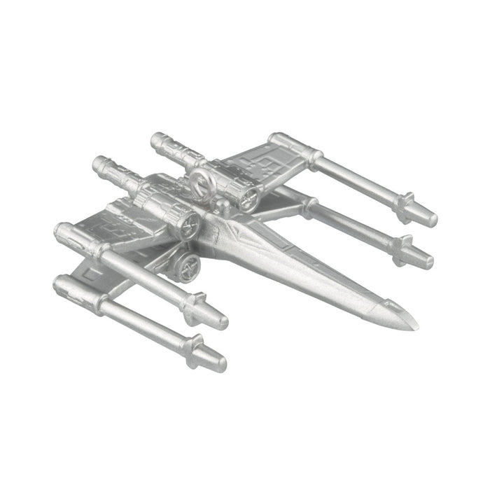 Metallic model of a spaceship on a white background
