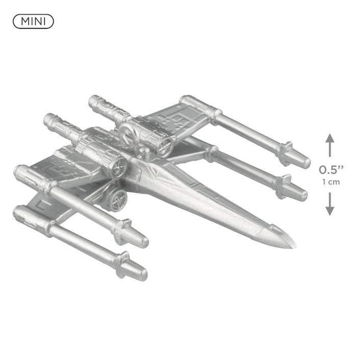 Metal model of a spaceship with scale indicators on a white background