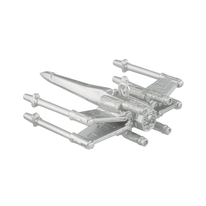 Metallic model of a spaceship on a white background