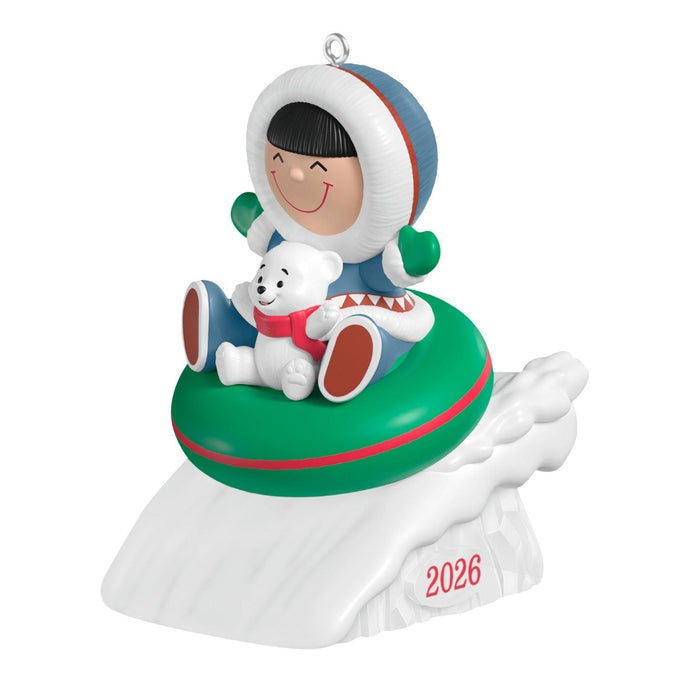 Christmas ornament featuring a child in a snowy scene with a dog, on a white background.