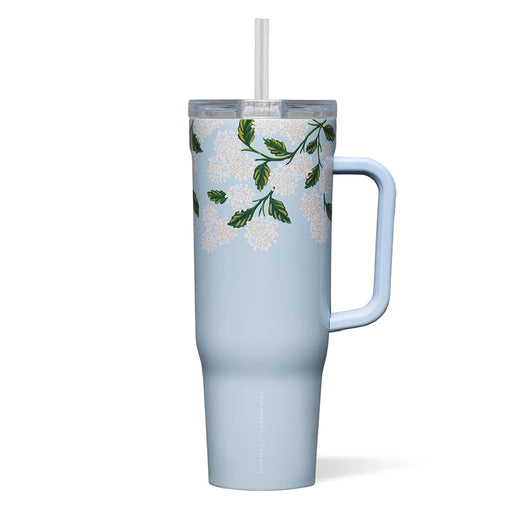 A blue tumbler featuring a white flower design and a straw, ideal for beverages on the go.