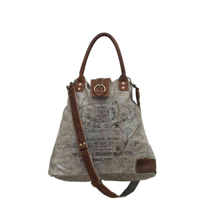 The Myra Bag Gerster Shoulder Bag features upcycled woven canvas with rich genuine leather accents. 