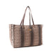 A patterned brown and white tote bag, showcasing a unique design suitable for everyday use and fashion.
