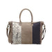 Canvas vintage bag embellished with multiple patches, highlighting a distinctive and creative design.