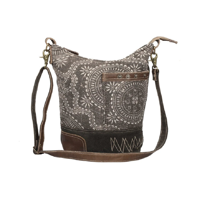 Leather paisley print bag featuring a stylish brown strap for a chic and elegant look.